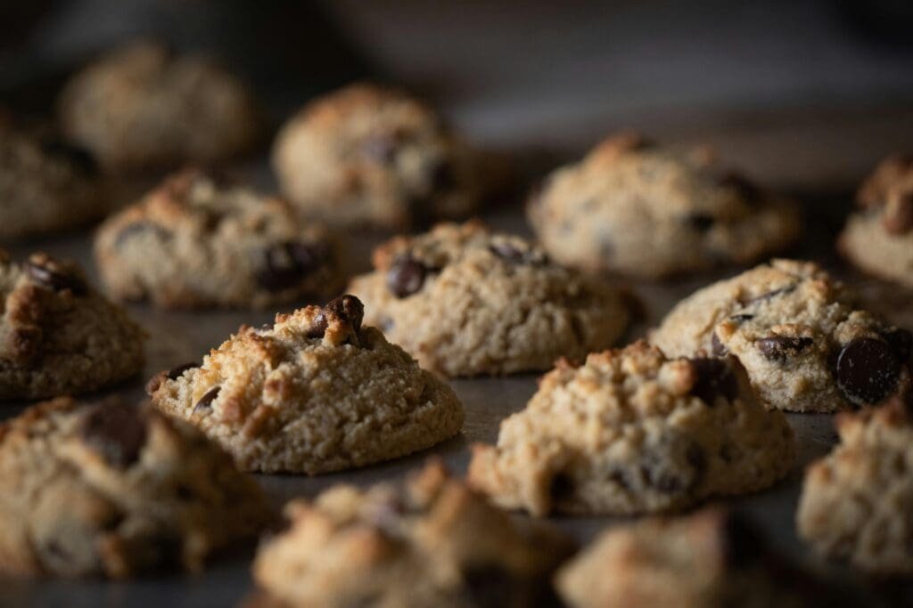 pexels-photo-1775283-1775283 A close-up shot of freshly baked chocolate chip cookies on a tray, showcasing their texture and indulgence.